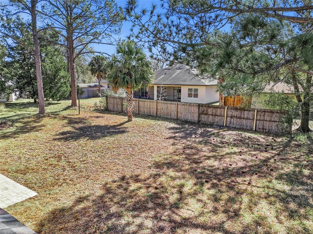 80 Providence Lane Palm Coast, FL 32164 - Photo 38 of 42 a front view of a house with a yard