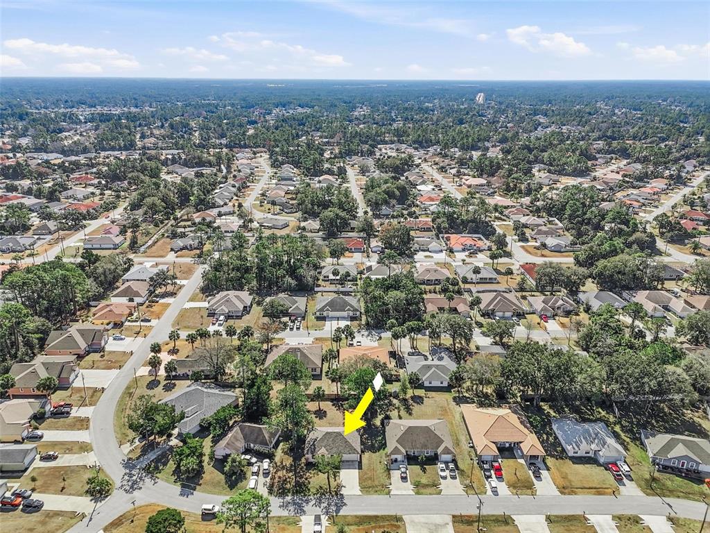 80 Providence Lane Palm Coast, FL 32164 - Photo 41 of 42 an aerial view of a city with lots of residential buildings