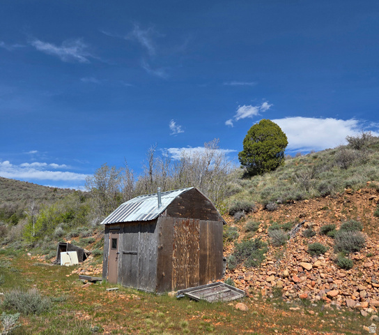 3325 North Oak Cyn Road, Unit 490 Huntsville, UT 84317 - Photo 11 of 25 Rustic outbuilding with wood siding and a corrugated metal roof