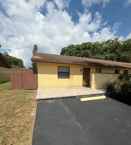 a house with trees in the background