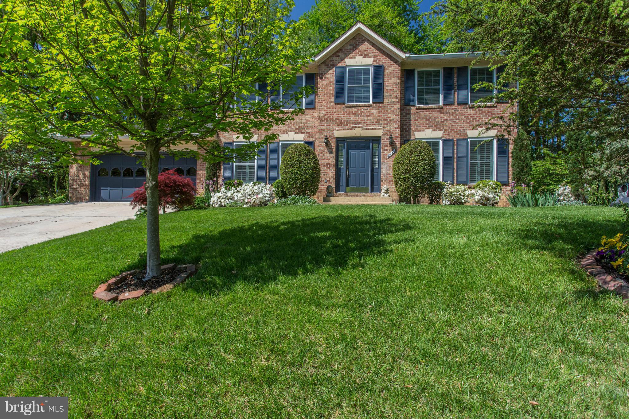 8230 Stacey Road Alexandria, VA 22308 - Photo 1 of 30 a front view of a house with a yard and trees