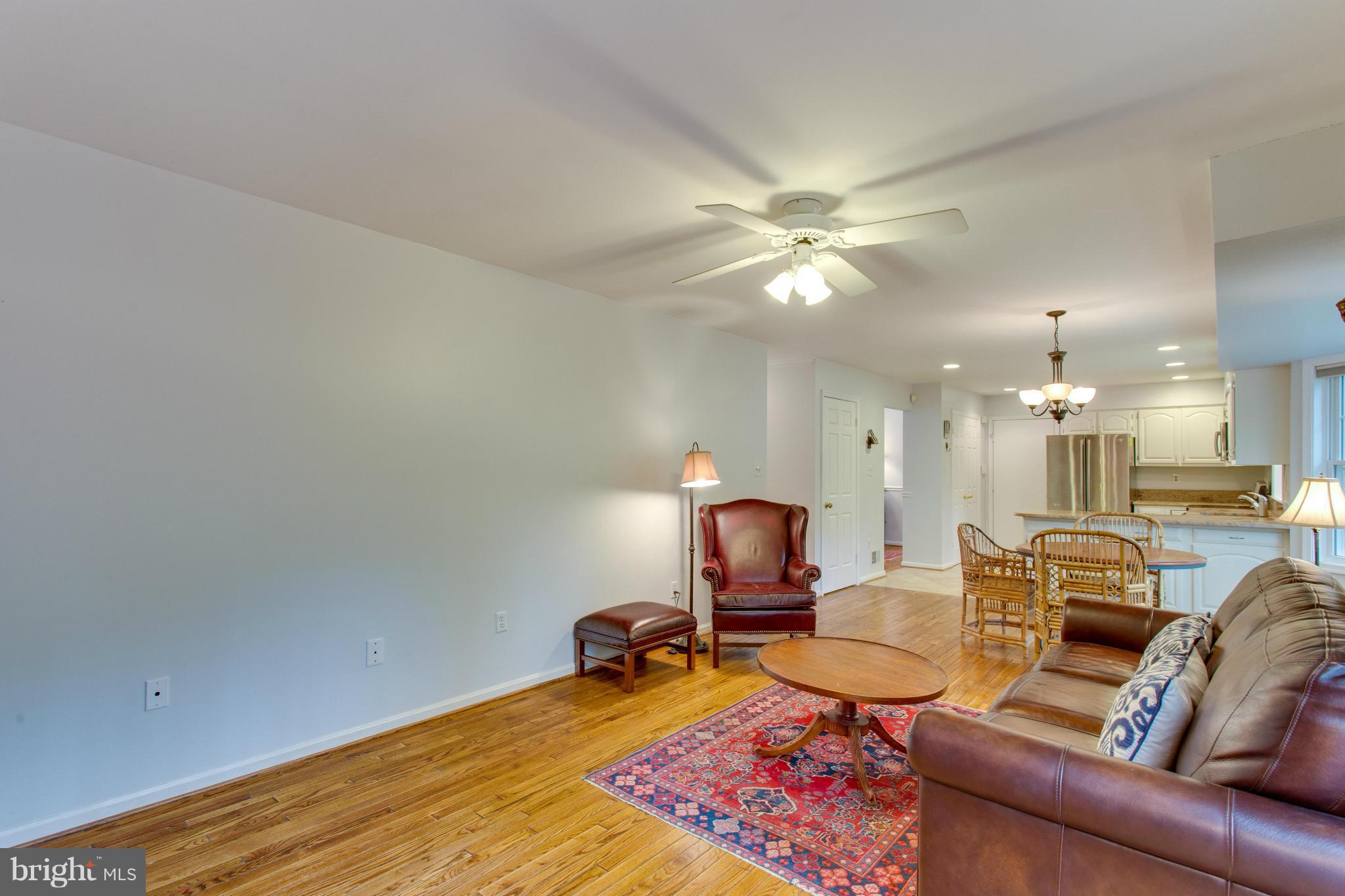 8230 Stacey Road Alexandria, VA 22308 - Photo 14 of 30 a living room with furniture and a chandelier
