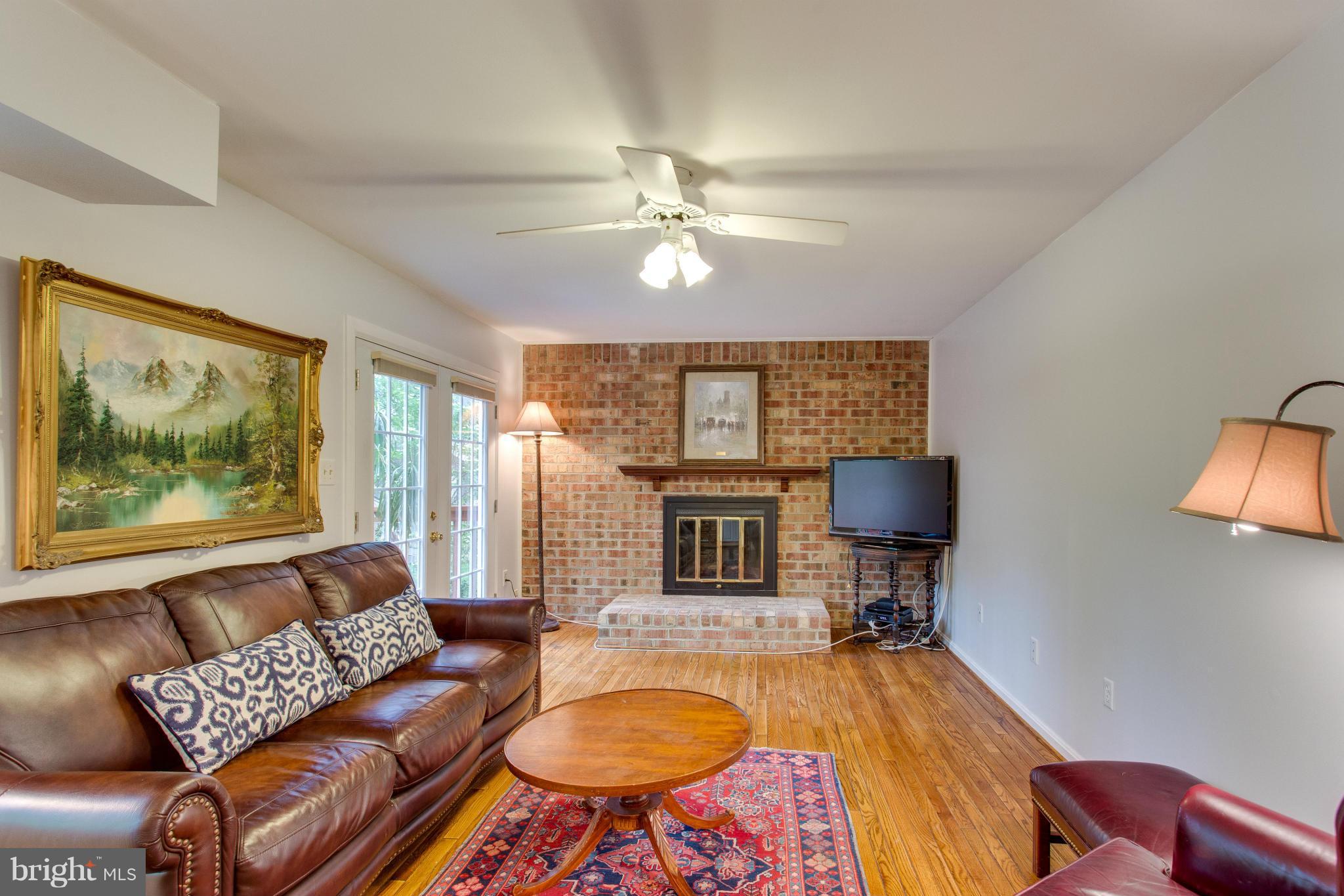 8230 Stacey Road Alexandria, VA 22308 - Photo 4 of 30 a living room with furniture and a flat screen tv