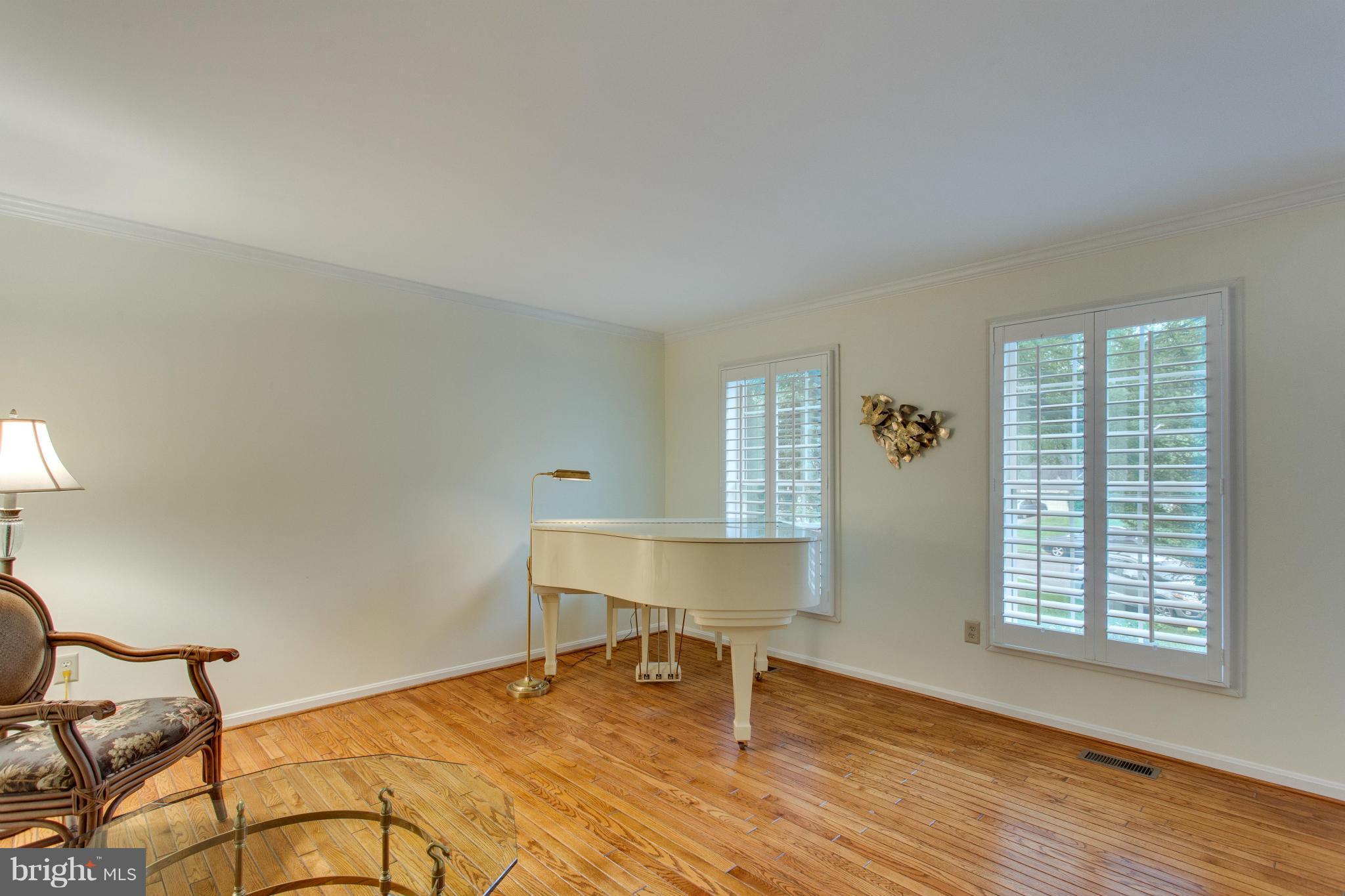 8230 Stacey Road Alexandria, VA 22308 - Photo 7 of 30 a bedroom with a bed and a window