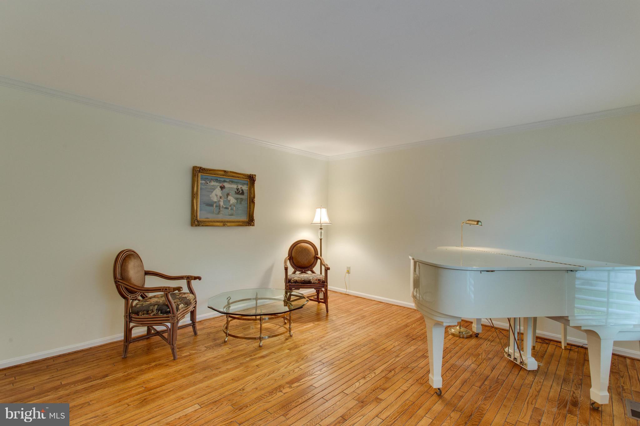 8230 Stacey Road Alexandria, VA 22308 - Photo 8 of 30 a view of a workspace with furniture and a chair