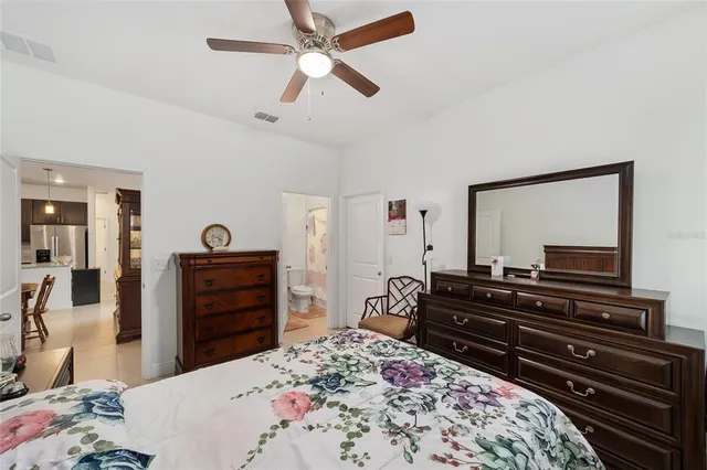 a bed room with a bed and a television