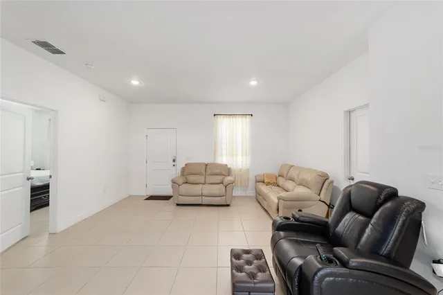 a living room with furniture and a couch