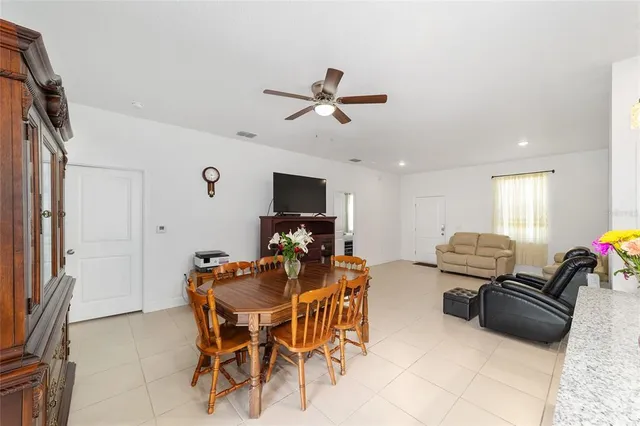 a view of a livingroom with furniture and a flat screen tv