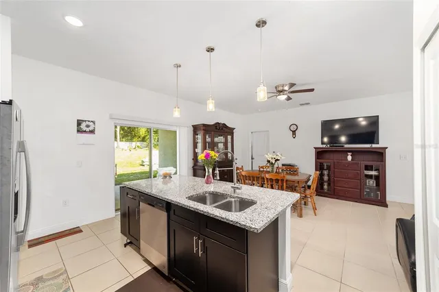 a kitchen with a sink and a refrigerator