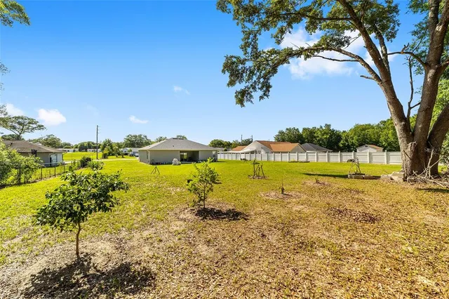 a view of a lake with houses in the background