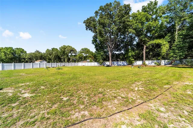 a view of a swimming pool with an outdoor space and seating area
