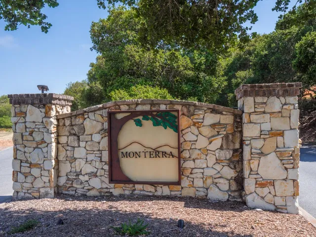 a view of a wooden fence and trees