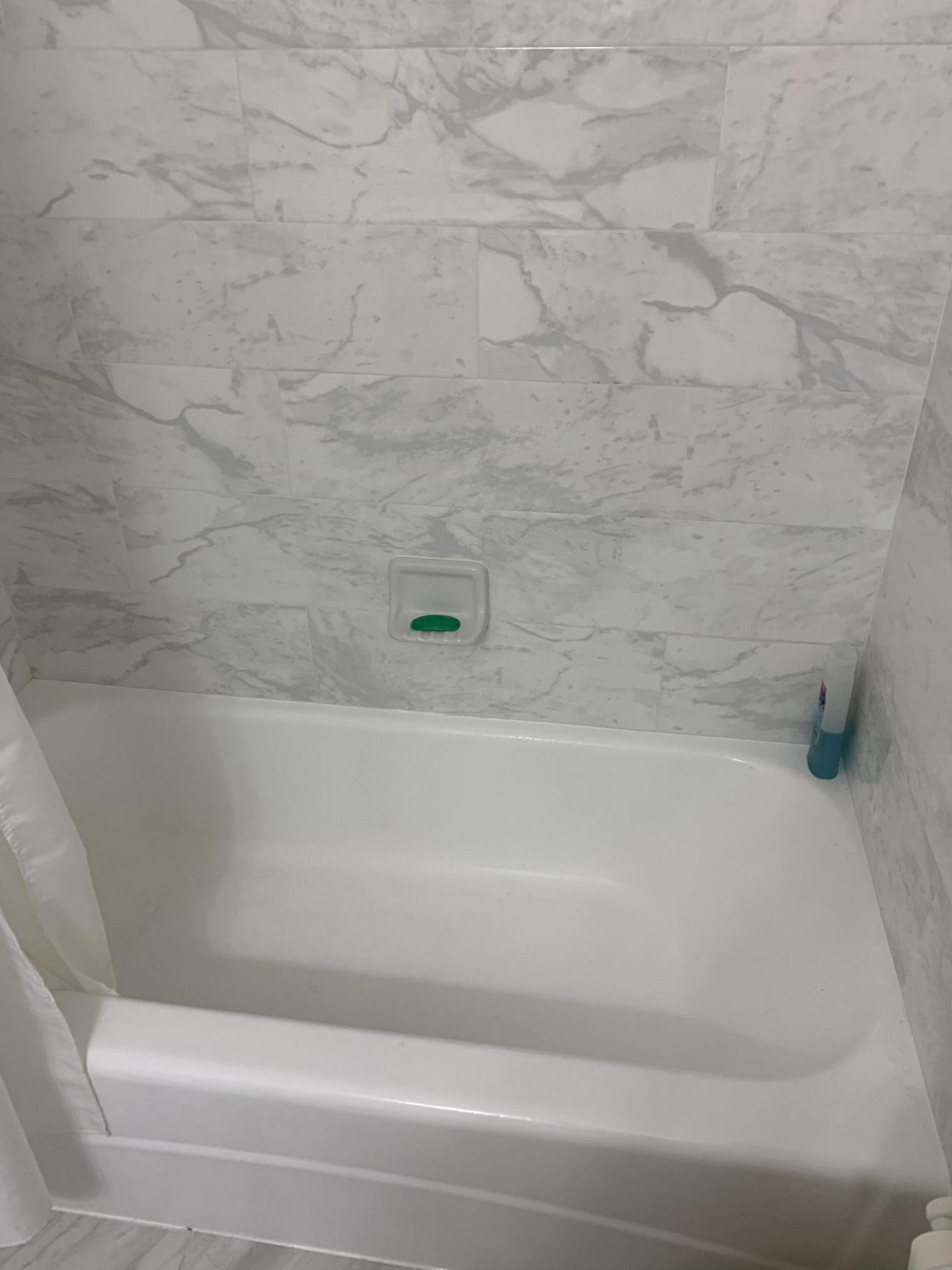 19 Colonial Club Drive, Unit 202 Boynton Beach, FL 33435 - Photo 12 of 18 a bathroom with a bathtub