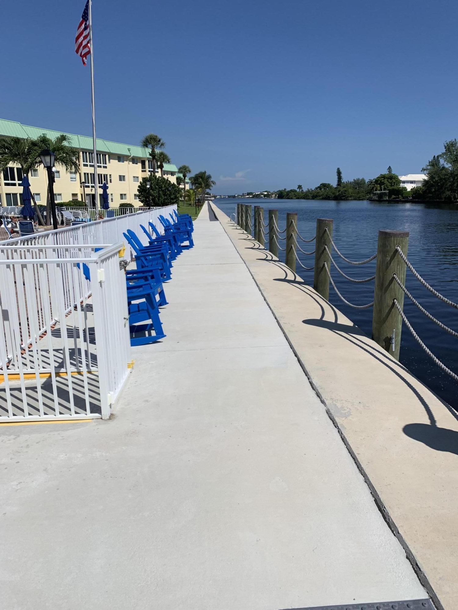 19 Colonial Club Drive, Unit 202 Boynton Beach, FL 33435 - Photo 15 of 18 a view of balcony with two chairs and a table
