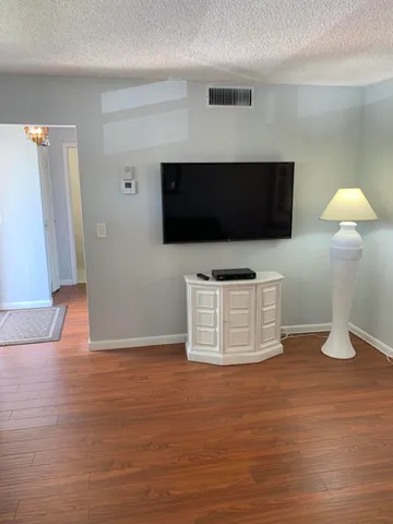 a dining room with furniture window wooden floor