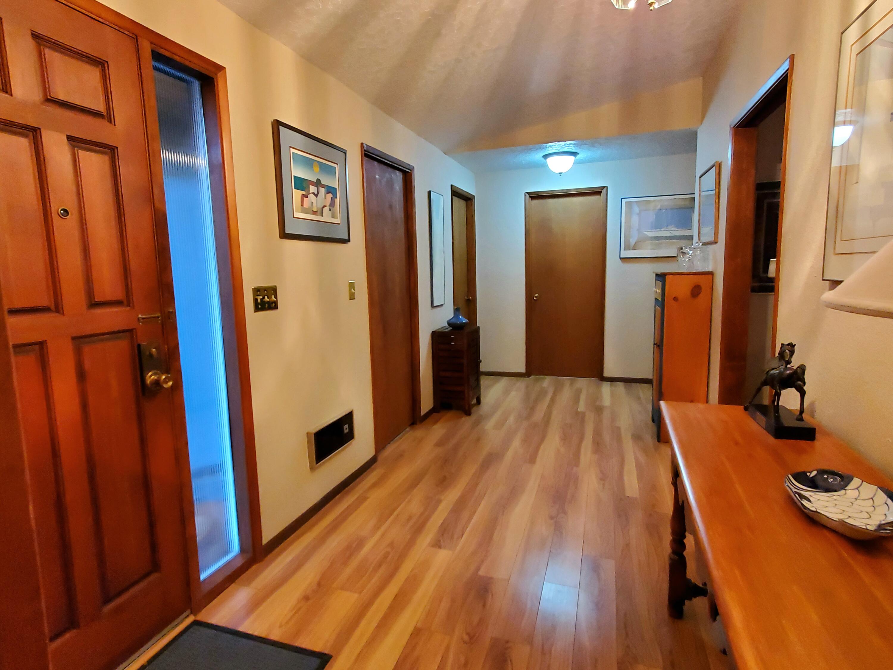 20397 Strawline Road Bend, OR 97702 - Photo 5 of 25 Laminate wood flooring.