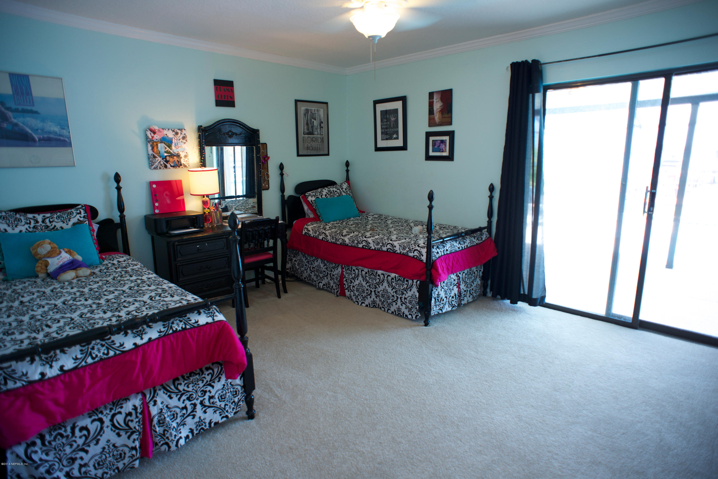 4109 Magnolia Road Orange Park, FL 32065 - Photo 16 of 32 a bedroom with a bed and a window