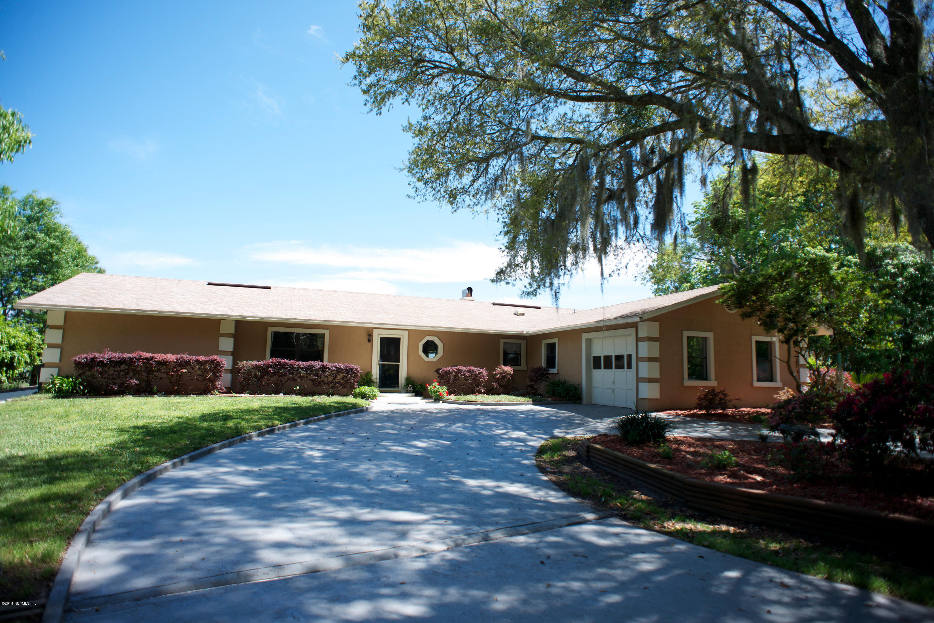 4109 Magnolia Road Orange Park, FL 32065 - Photo 3 of 32 a front view of house with yard and green space