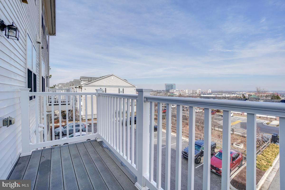 1709 Fieldstone Court Hanover, MD 21076 - Photo 17 of 30 a view of a balcony with wooden floor