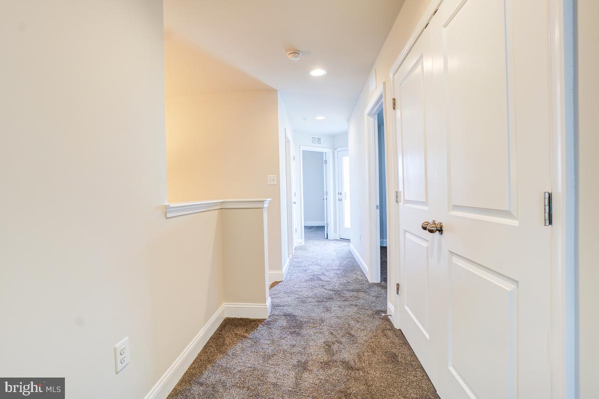 1709 Fieldstone Court Hanover, MD 21076 - Photo 18 of 30 a view of a hallway with a white walls