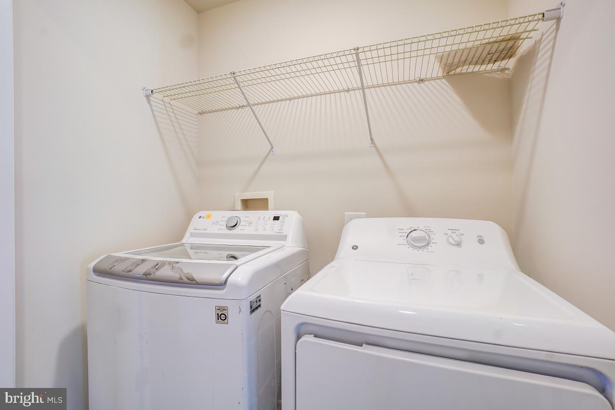 1709 Fieldstone Court Hanover, MD 21076 - Photo 24 of 30 a utility room with dryer and washer