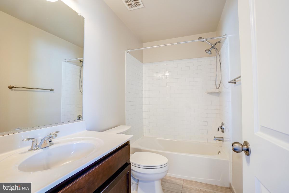 1709 Fieldstone Court Hanover, MD 21076 - Photo 26 of 30 a bathroom with a sink toilet and shower