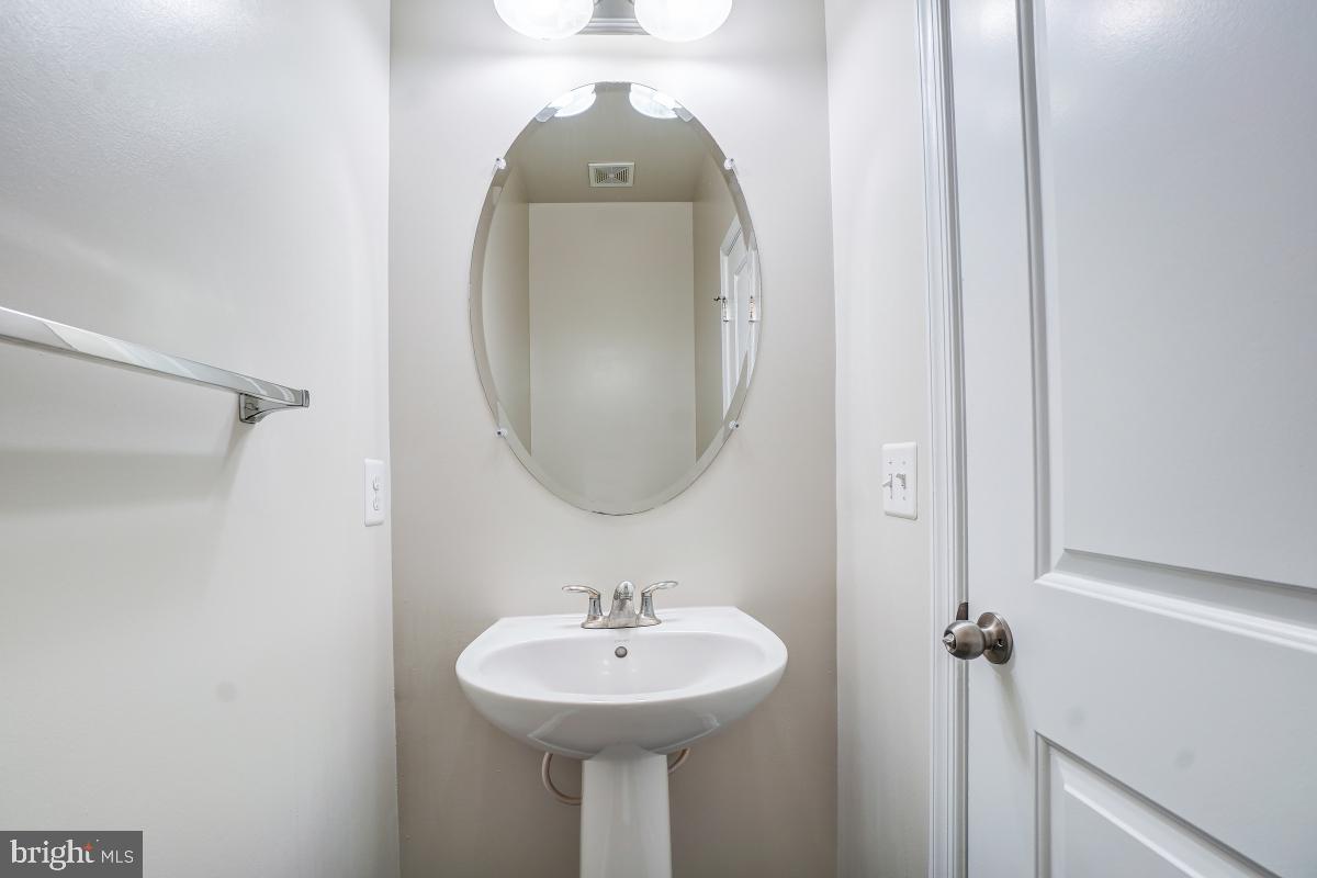 1709 Fieldstone Court Hanover, MD 21076 - Photo 8 of 30 a bathroom with a sink and a mirror