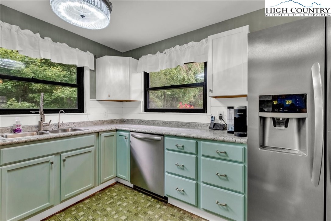 360 Fraser Road Sparta, NC 28675 - Photo 12 of 50 a kitchen with a sink and a large mirror