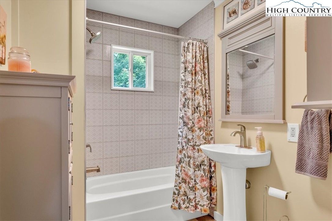 360 Fraser Road Sparta, NC 28675 - Photo 16 of 50 a bathroom with a sink and a mirror