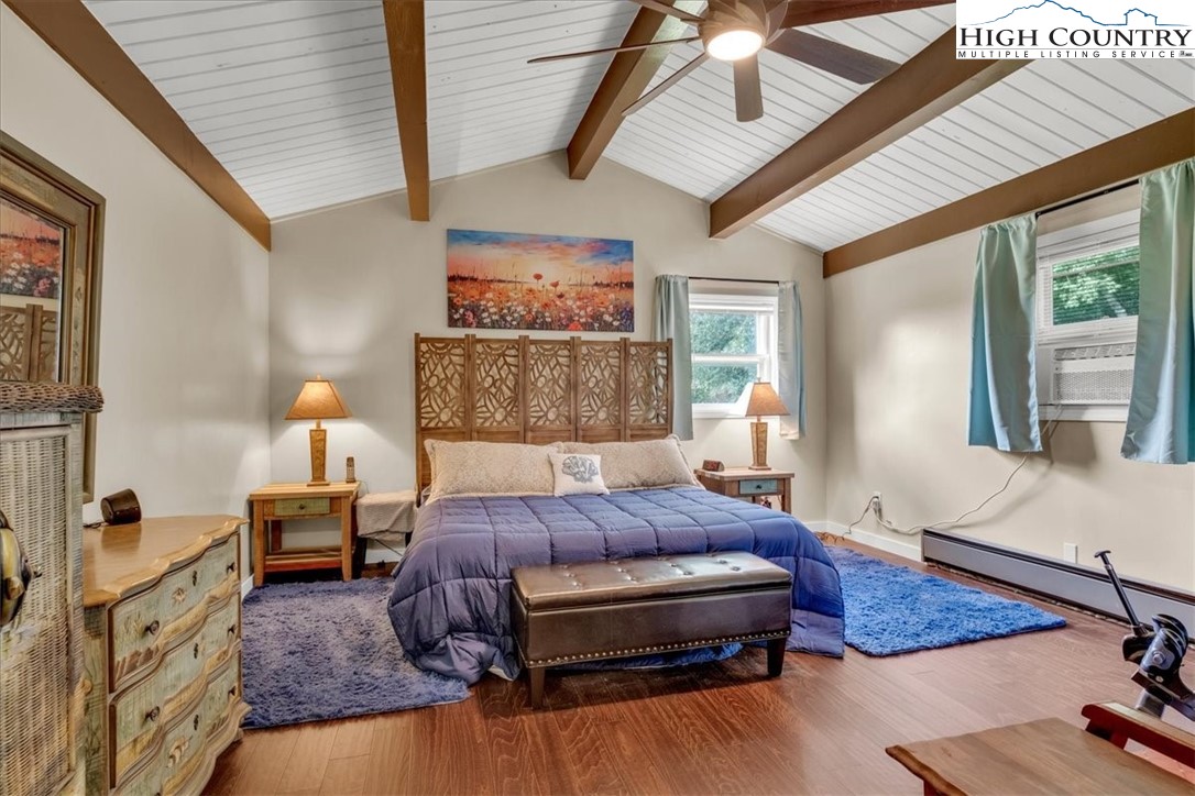 360 Fraser Road Sparta, NC 28675 - Photo 19 of 50 a spacious bedroom with a bed and window