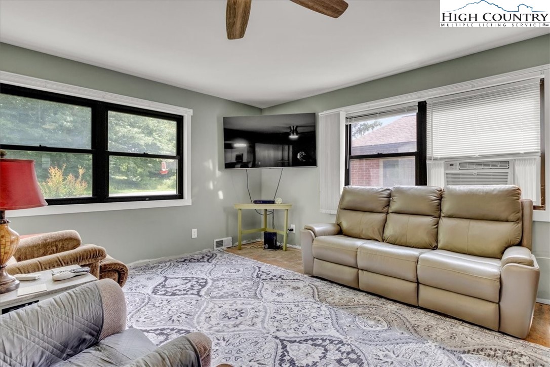 360 Fraser Road Sparta, NC 28675 - Photo 33 of 50 a living room with furniture and a flat screen tv