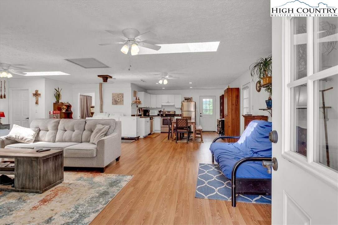360 Fraser Road Sparta, NC 28675 - Photo 39 of 50 a living room with furniture and wooden floor