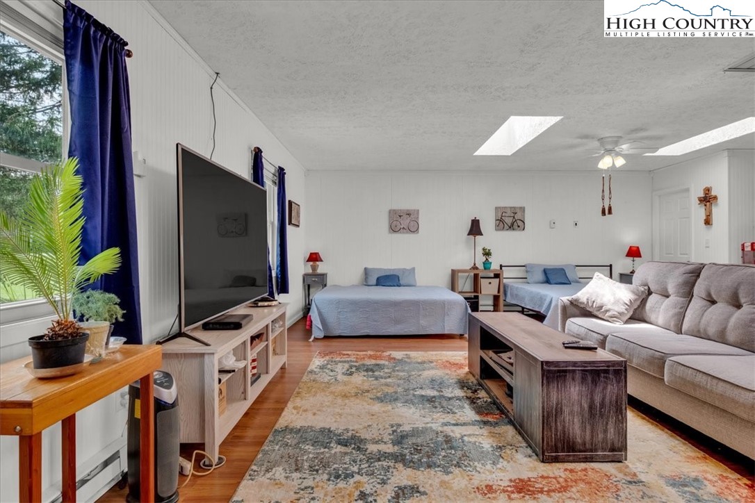 360 Fraser Road Sparta, NC 28675 - Photo 40 of 50 a living room with furniture and a flat screen tv