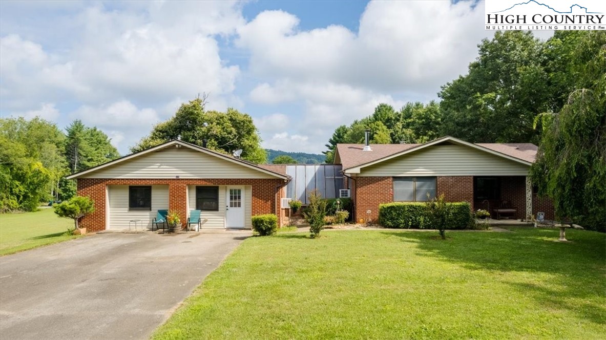360 Fraser Road Sparta, NC 28675 - Photo 4 of 50 a front view of a house with a yard