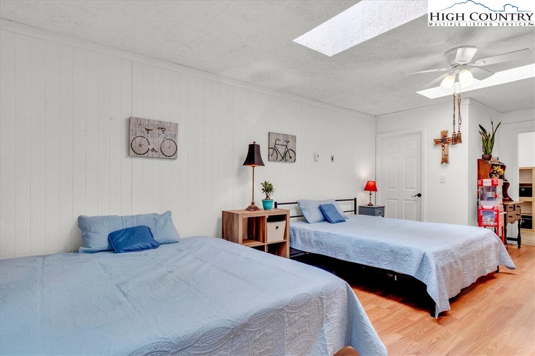 360 Fraser Road Sparta, NC 28675 - Photo 41 of 50 a bedroom with two beds and painted walls