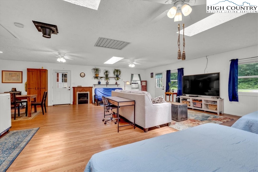360 Fraser Road Sparta, NC 28675 - Photo 42 of 50 a living room with furniture and a flat screen tv
