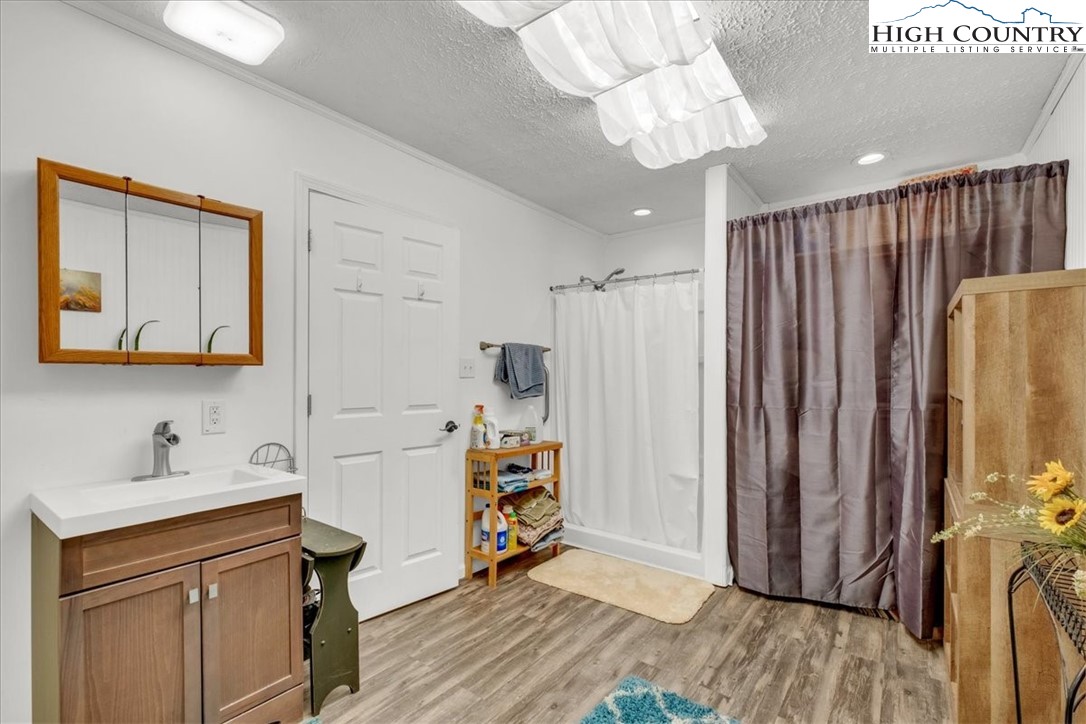 360 Fraser Road Sparta, NC 28675 - Photo 49 of 50 a kitchen with stainless steel appliances a refrigerator and a wooden floor