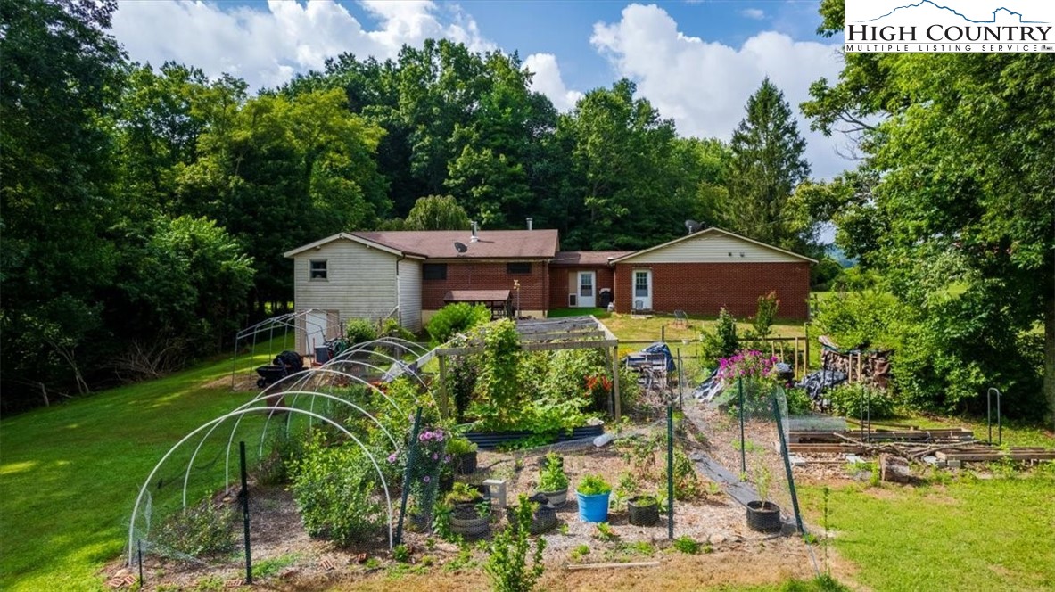 360 Fraser Road Sparta, NC 28675 - Photo 5 of 50 a front view of a house with a yard