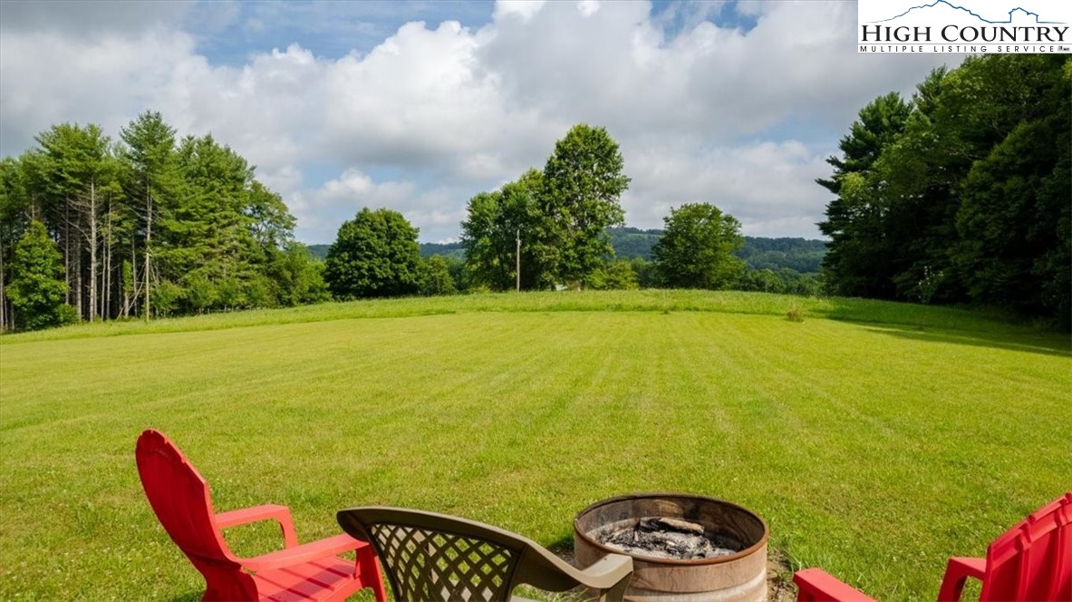 360 Fraser Road Sparta, NC 28675 - Photo 6 of 50 a view of a swimming pool and outdoor seating