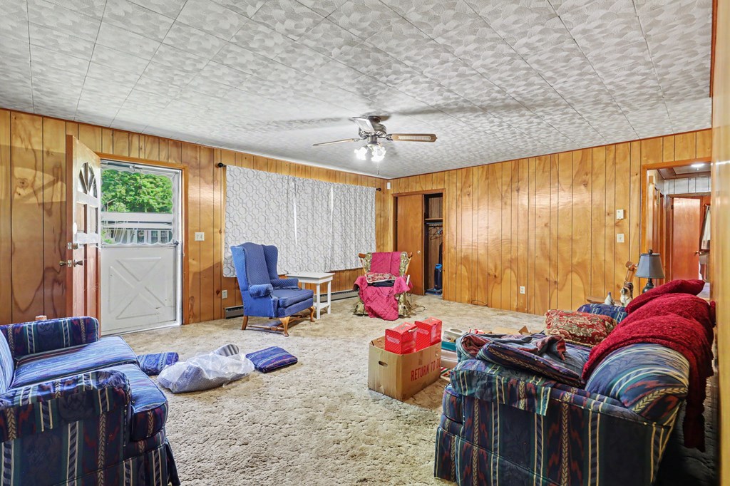 63 Fort Butler Street Murphy, NC 28906 - Photo 8 of 30 a living room filled with furniture and a chandelier