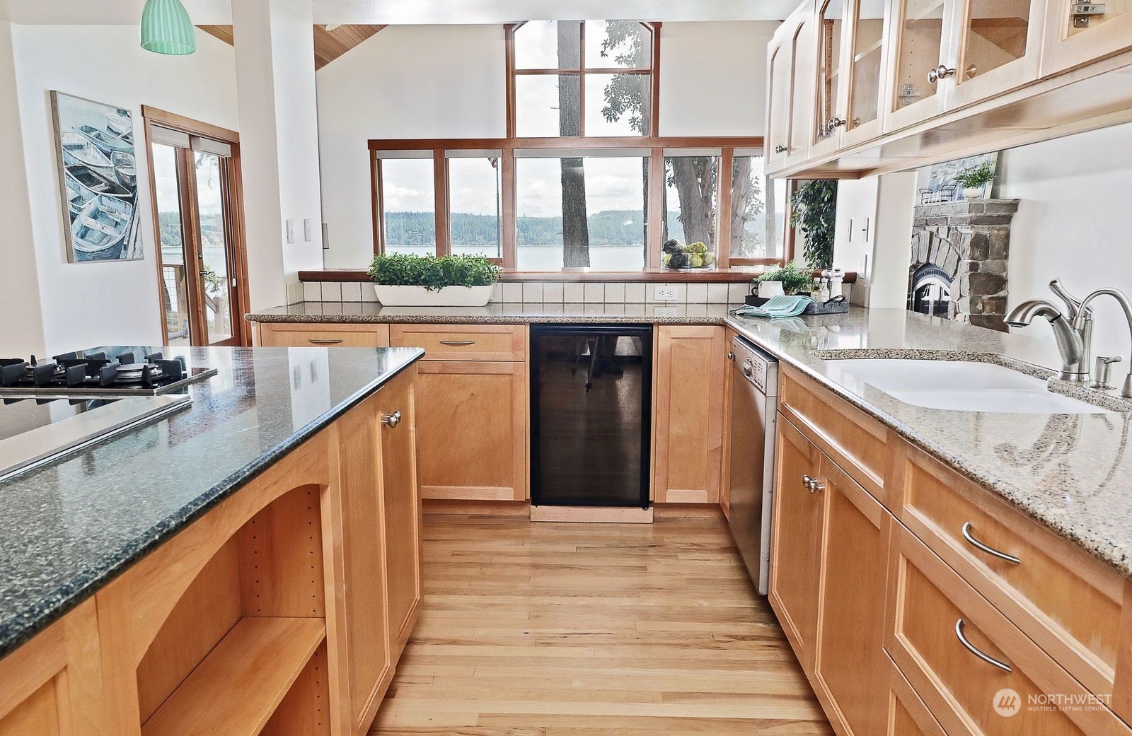 1292 Dines Point Road Greenbank, WA 98253 - Photo 16 of 40 a kitchen with stainless steel appliances granite countertop a sink and a stove