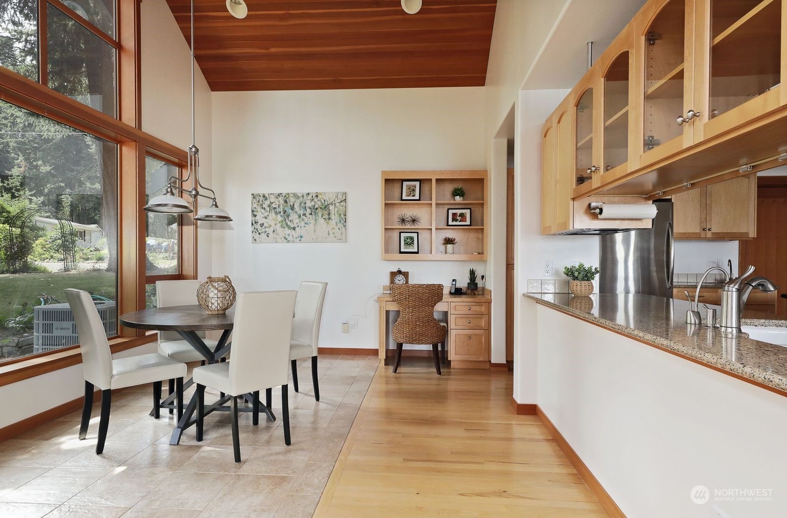 1292 Dines Point Road Greenbank, WA 98253 - Photo 17 of 40 a view of a dining room with furniture window and wooden floor