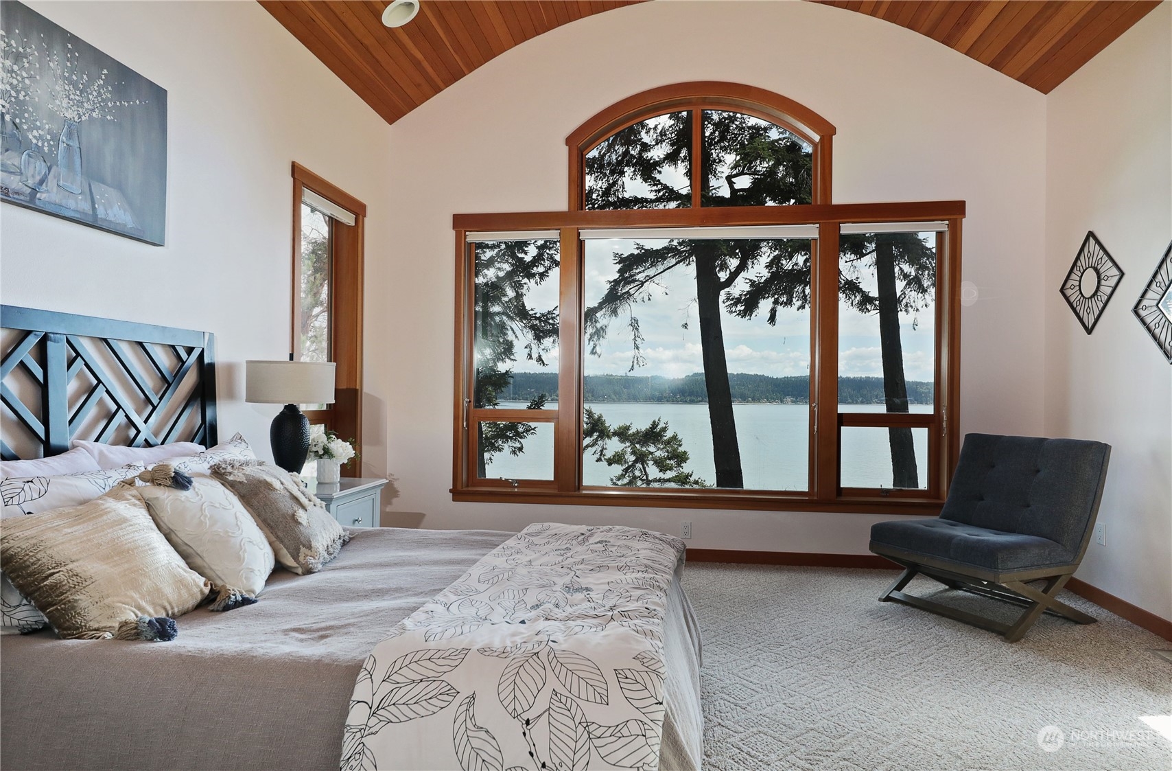 1292 Dines Point Road Greenbank, WA 98253 - Photo 20 of 40 a bedroom with a large bed and a large window