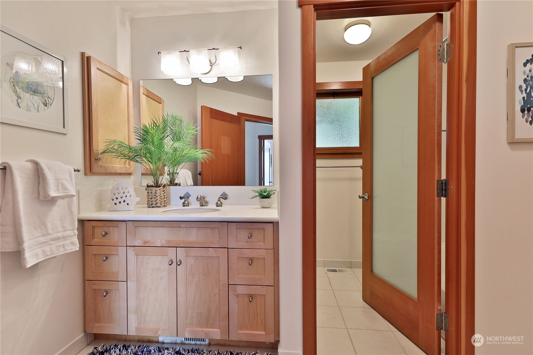 1292 Dines Point Road Greenbank, WA 98253 - Photo 22 of 40 a bathroom with a sink and a mirror