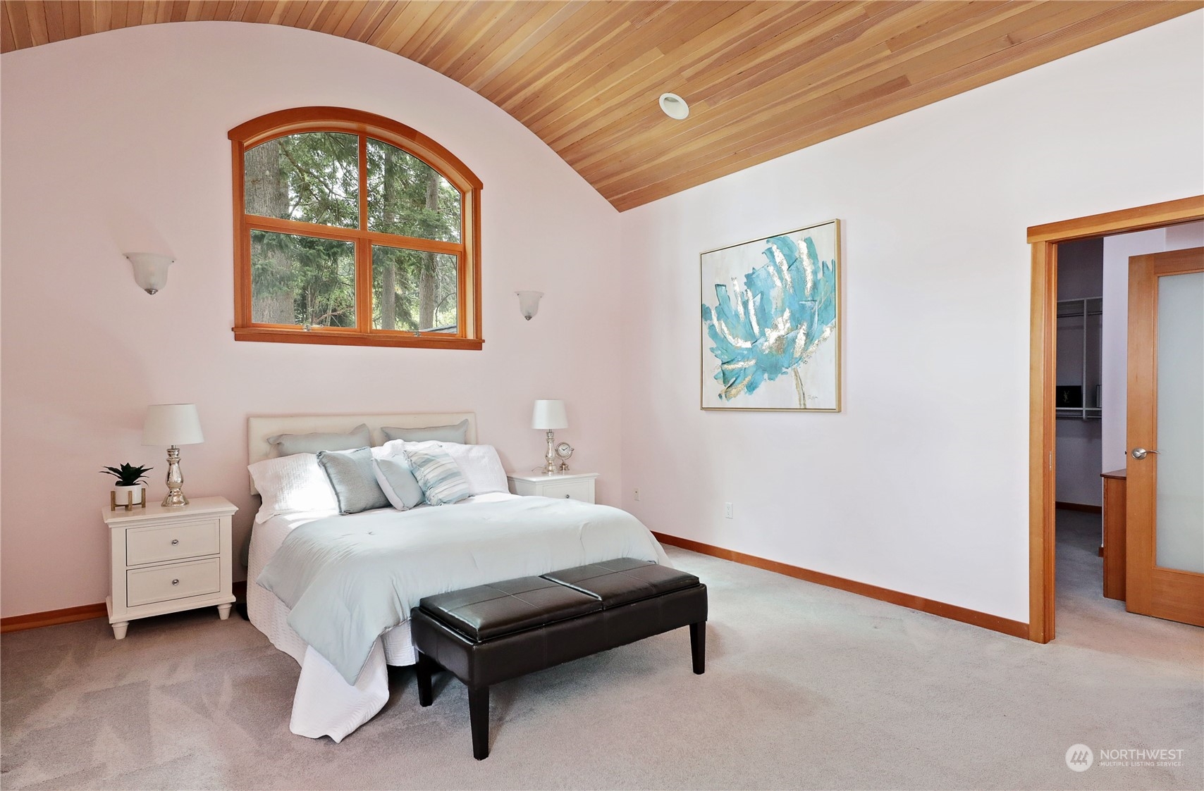 1292 Dines Point Road Greenbank, WA 98253 - Photo 27 of 40 a bedroom with a bed and a painting on the wall