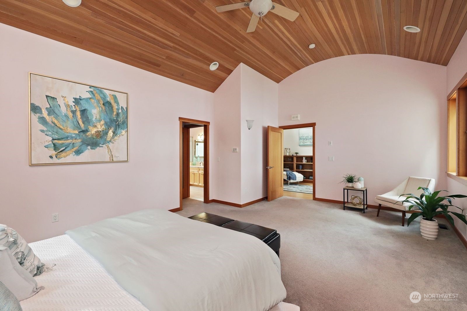 1292 Dines Point Road Greenbank, WA 98253 - Photo 28 of 40 a bedroom with a bed and a painting on the wall