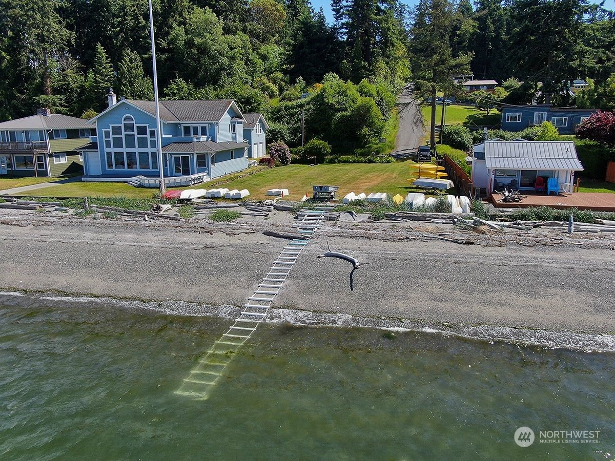 1292 Dines Point Road Greenbank, WA 98253 - Photo 39 of 40 a view of a house with a yard
