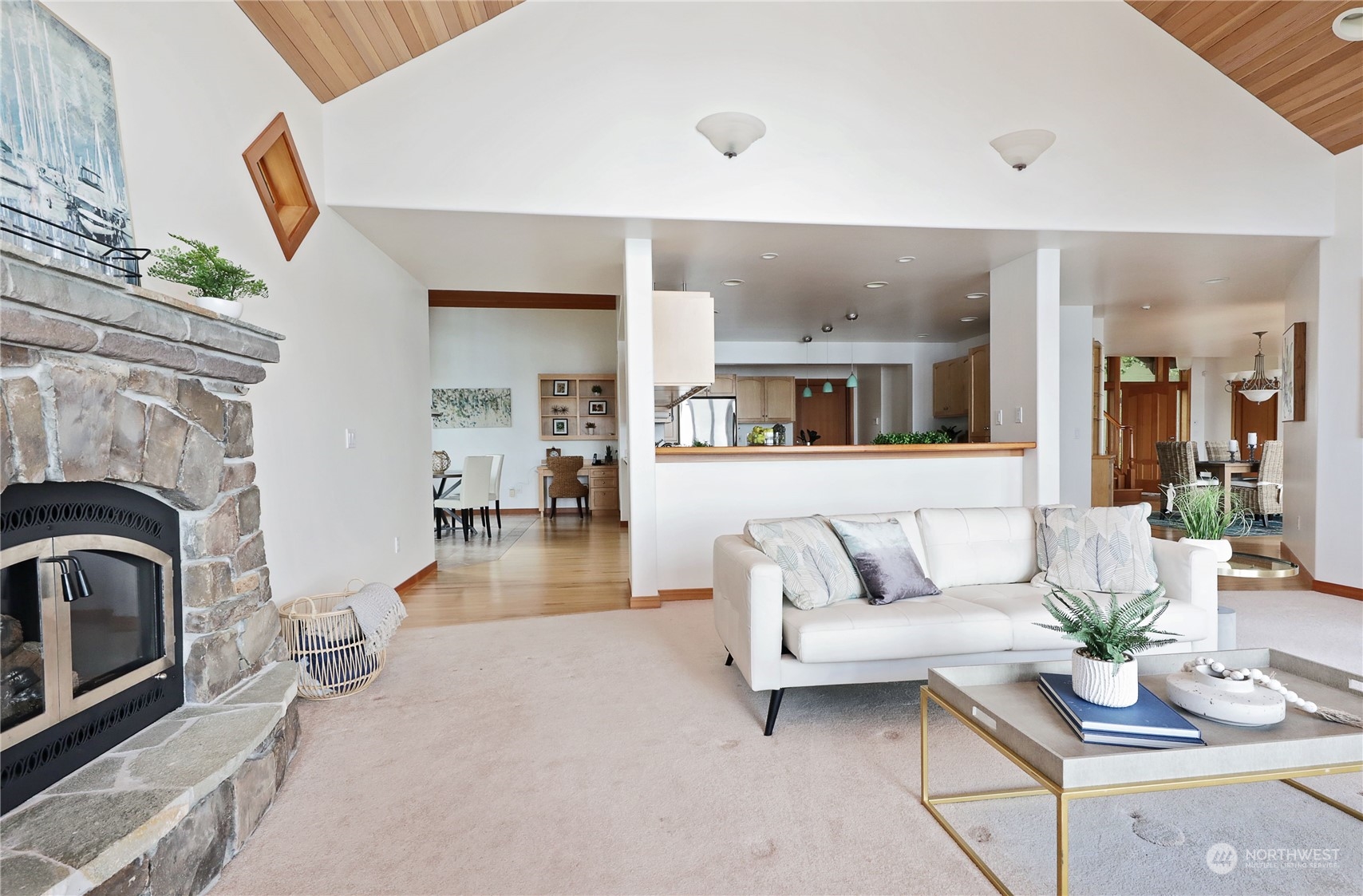 1292 Dines Point Road Greenbank, WA 98253 - Photo 10 of 40 a living room with furniture and a fireplace