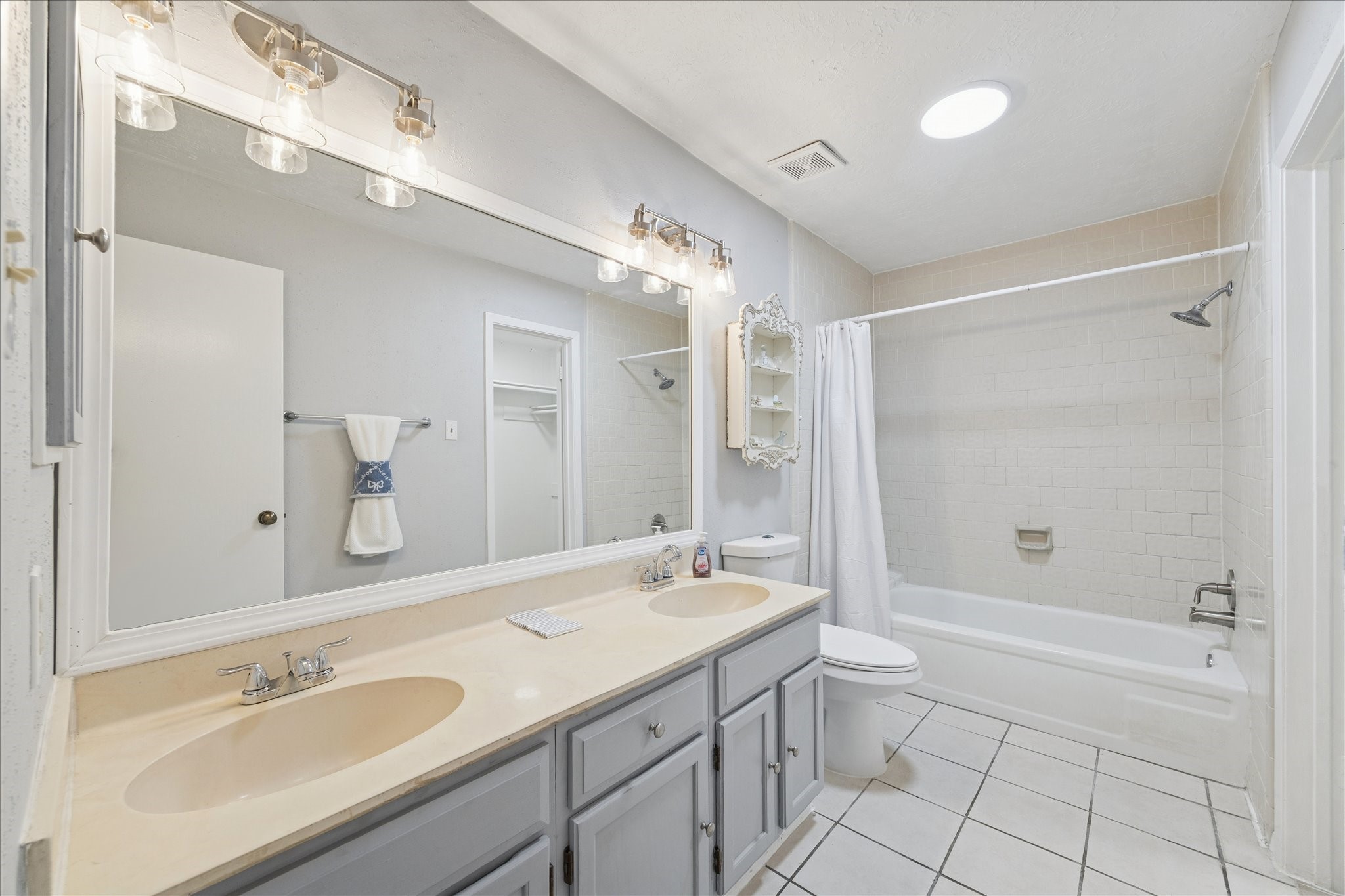9306 Riverside Lodge Drive Houston, TX 77083 - Photo 14 of 20 a bathroom with a granite countertop sink mirror and shower