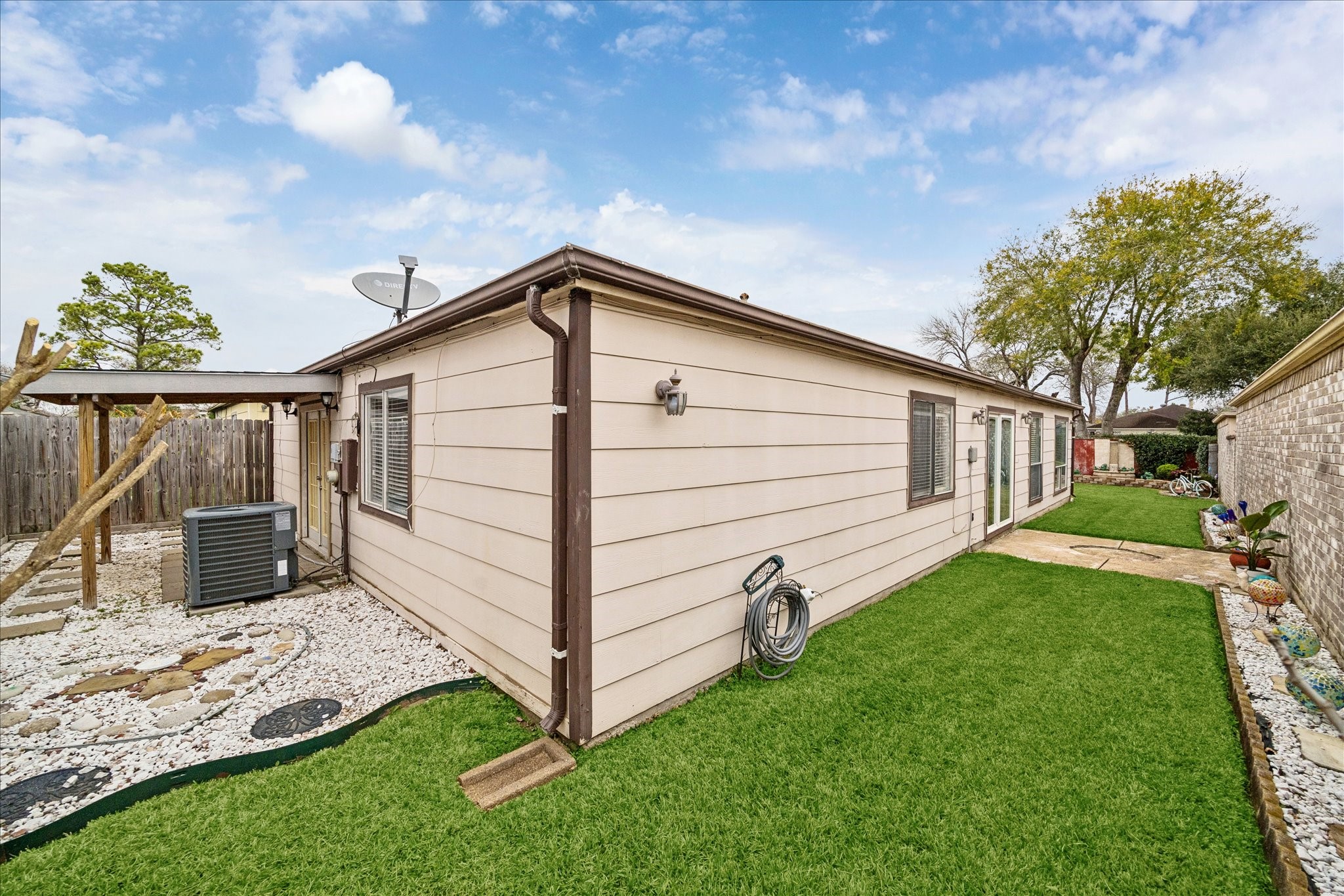 9306 Riverside Lodge Drive Houston, TX 77083 - Photo 20 of 20 a view of a house with a yard